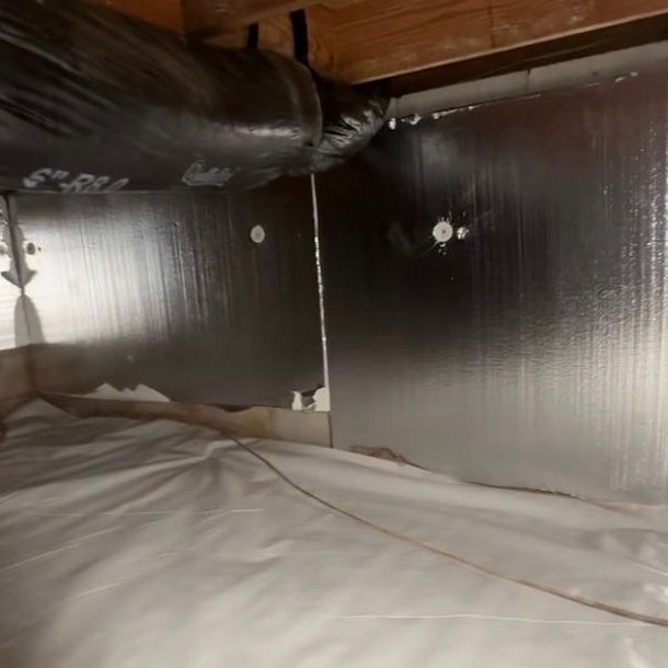 Rigid foam board insulation installed in an encapsulated crawl space