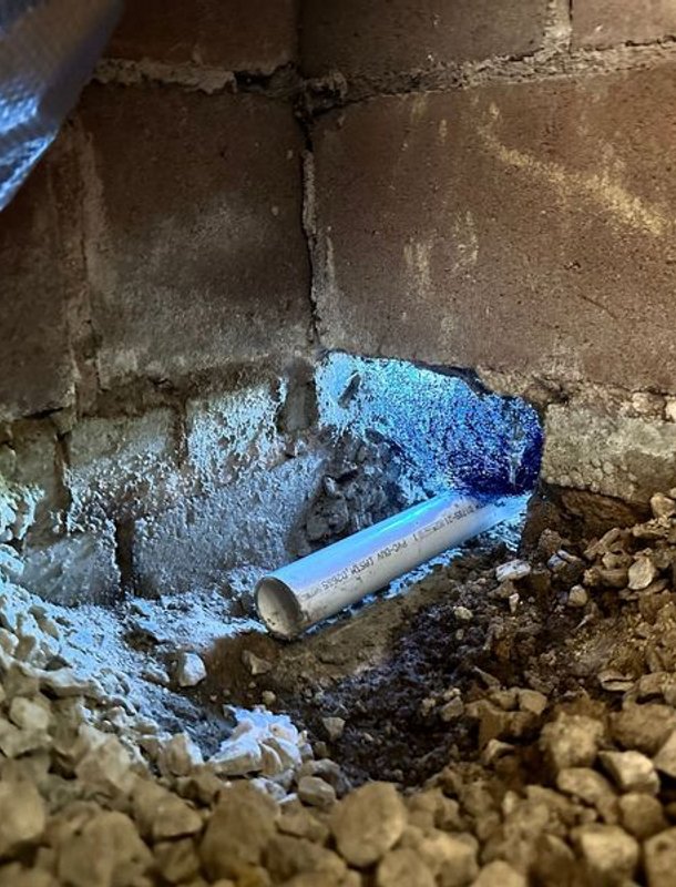 Drainage piping along a crawl space perimeter