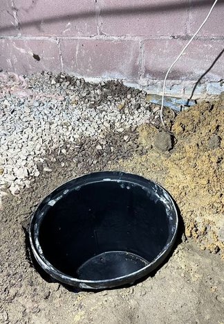 Interior French drain and liner in a crawl space