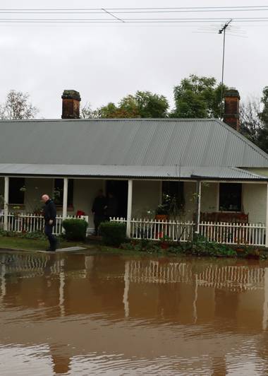 Standing water pooled in a crawl space after rain